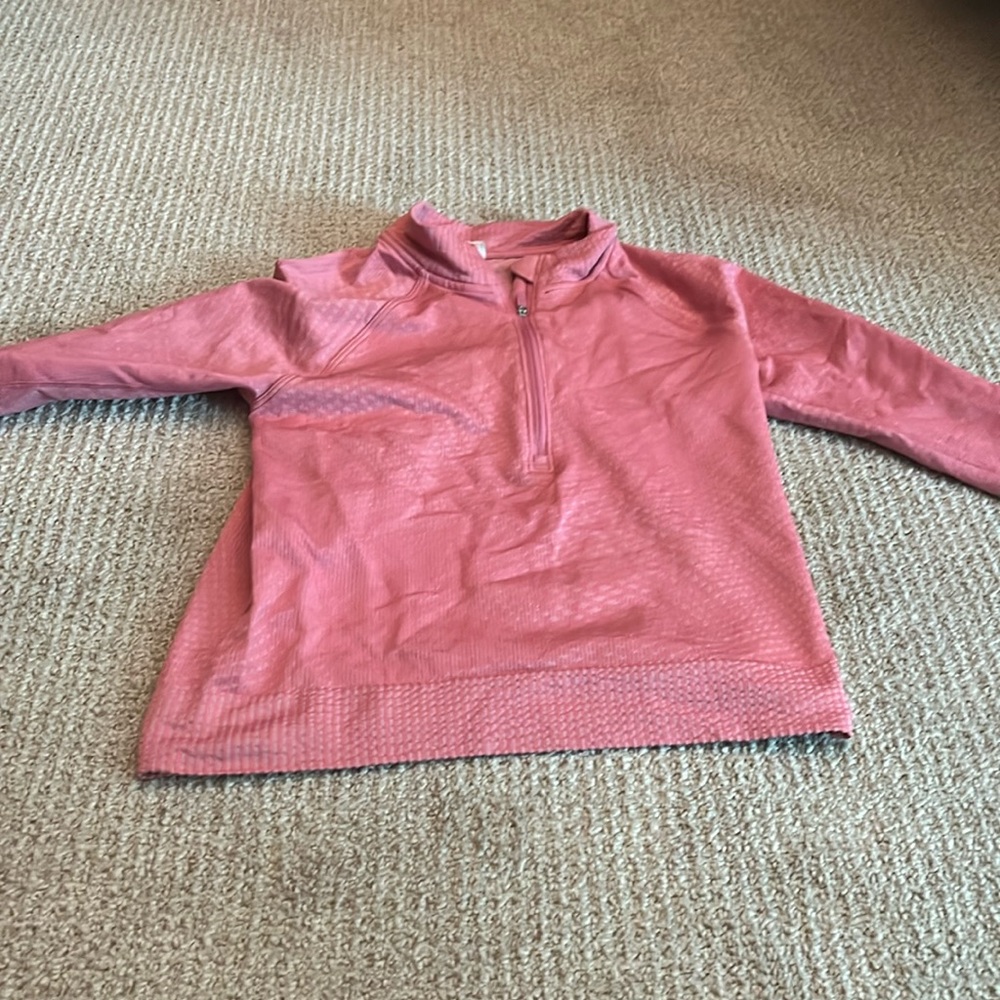 Never worn, pink long sleeved crop zip up from Lululemon.
